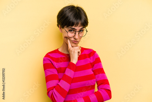 Young caucasian woman with a short hair cut isolated contemplating, planning a strategy, thinking about the way of a business.