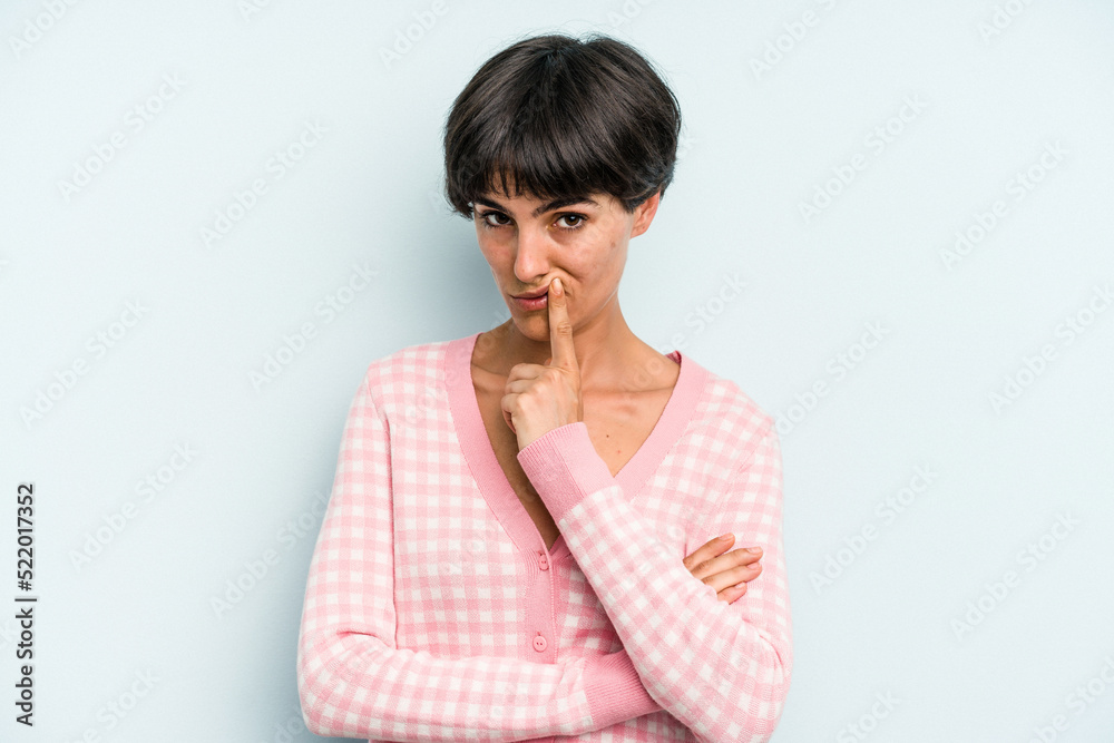 Young caucasian woman with a short hair cut isolated unhappy looking in camera with sarcastic expression. Young caucasian woman with a short hair cut isolated unhappy looking in camera with sarcastic expression.