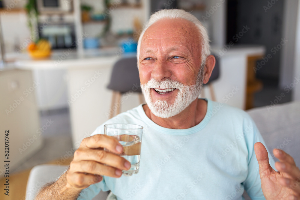 Senior man drink water from glass. Good health, lifestyle.