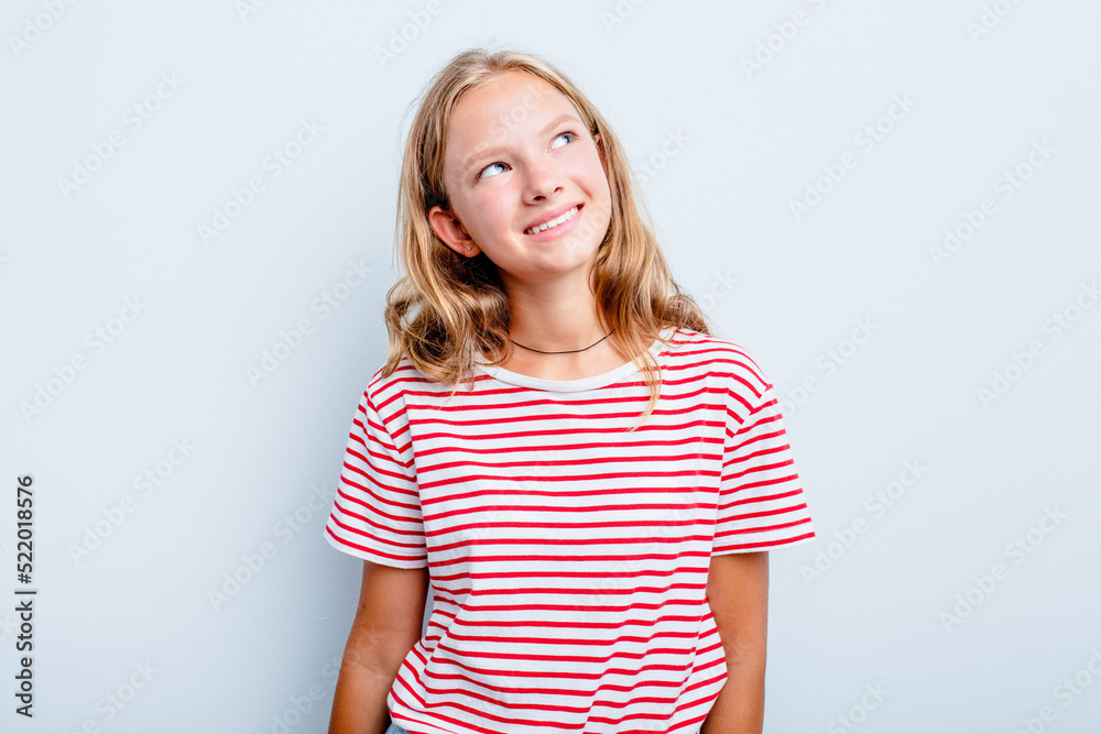 Caucasian teen girl isolated on blue background relaxed and happy laughing, neck stretched showing teeth. Caucasian teen girl isolated on blue background relaxed and happy laughing, neck stretched showing teeth.