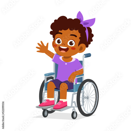 little kid sit on wheelchair and feel happy