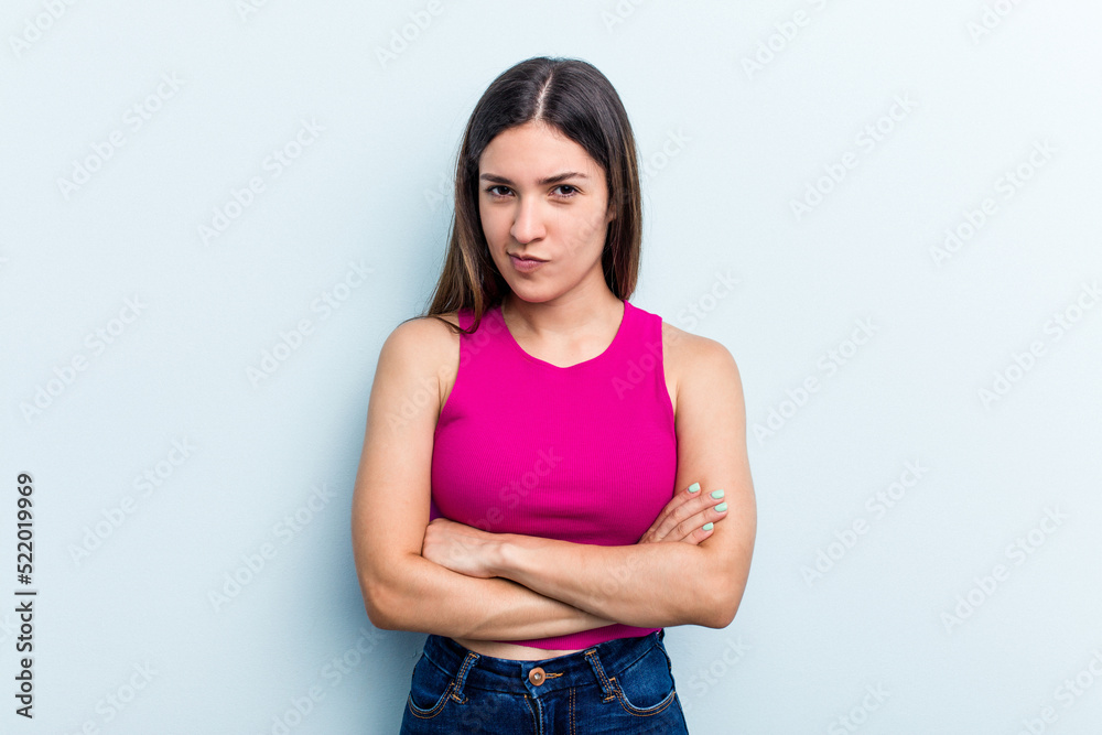 Young caucasian woman isolated on blue background unhappy looking in camera with sarcastic expression. Young caucasian woman isolated on blue background unhappy looking in camera with sarcastic expression.