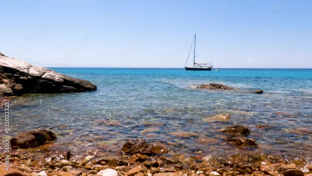 Perfect view of seascape with yacht, pleasure of sailing. Turquoise color of sea. Rocky shoreline. Summer vacation. 4K Perfect view of seascape with yacht, pleasure of sailing. Turquoise color of sea. Rocky shoreline. Summer vacation. 4K