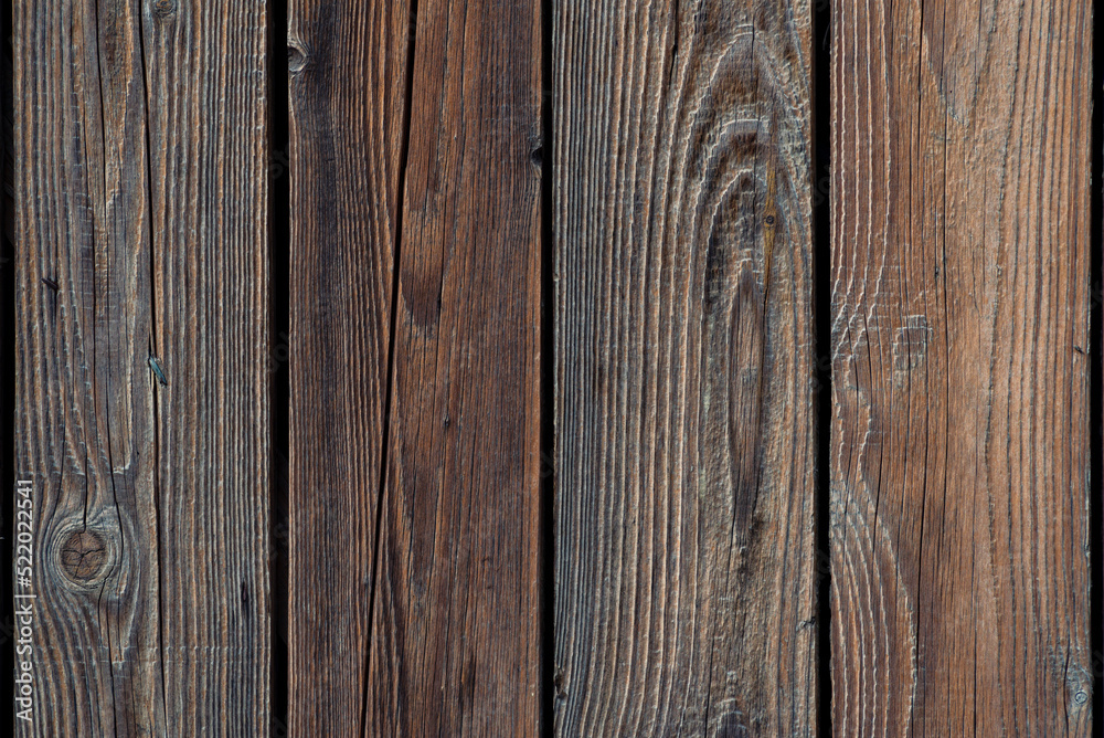 Fototapeta premium Brown natural wood dark background, vintage, with knots and nail holes, wood planks, old