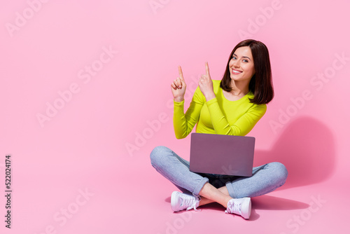 Photo of cute lady specialis tarm demonstrate offer distance work study use gadget device sit empty space isolated on pink color background