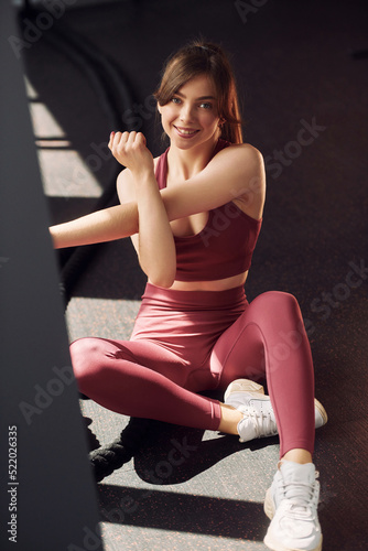 Ready to work. Young beautiful woman in sportive clothes have fitness day in the gym