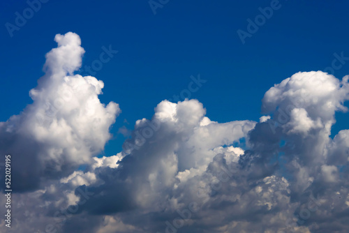 Blue sky with fluffy clouds