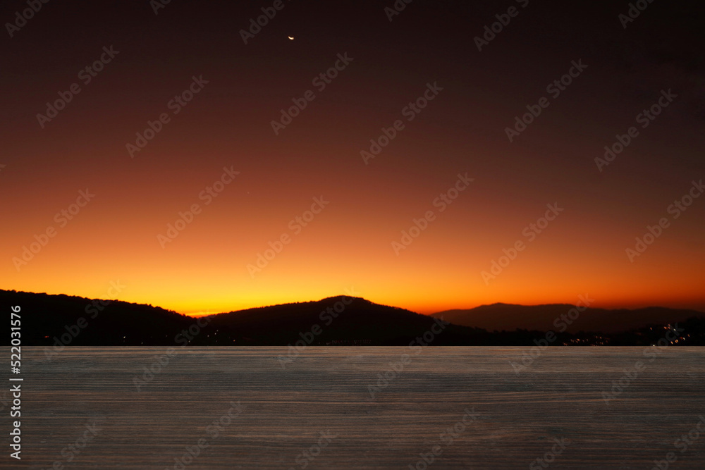 old empty wooden table morning scenery mountain backdrop blur or blurry (Focus only on the wooden board in front)