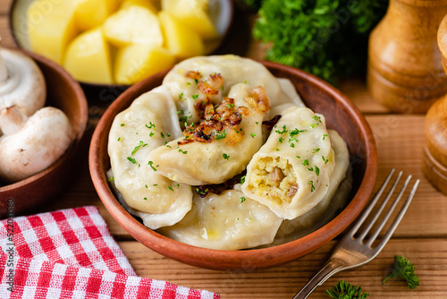 Potato mushroom stuffed vareniky, pierogi or dumplings. Ukrainian cuisine food photo