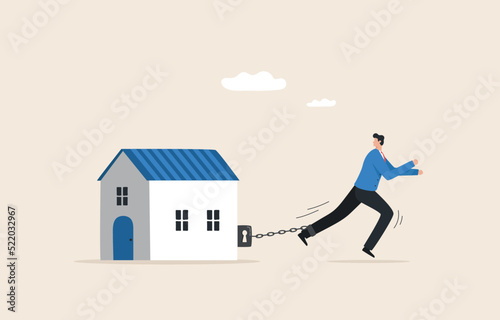 Mortgage debt, Home loan. Housing obligations.  Businessman chained to a house burdened by mortgage payment.