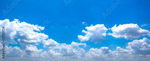 Blue sky with clouds background. Sky daylight. Natural sky composition. Element of design. © kanpisut
