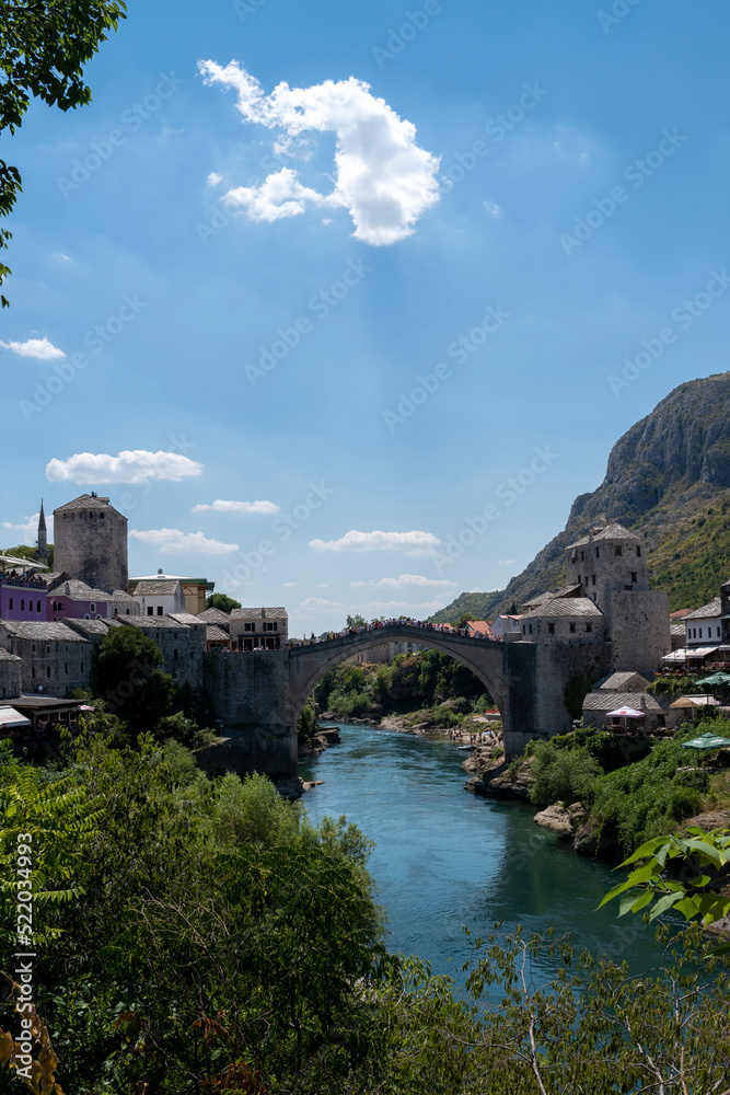 The Old Bridge in Mostar with river Neretva. Bosnia and Herzegovina The Old Bridge in Mostar with river Neretva. Bosnia and Herzegovina