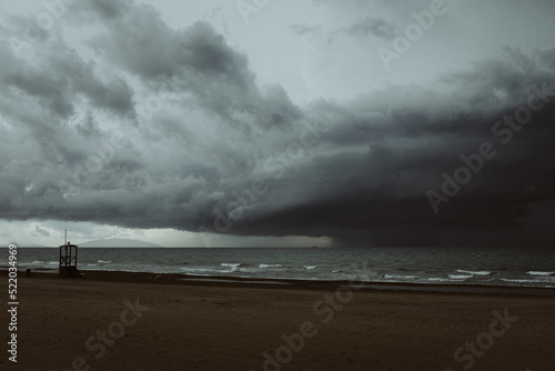 A heavy storm wit rain thunder lightning on the sea ocean