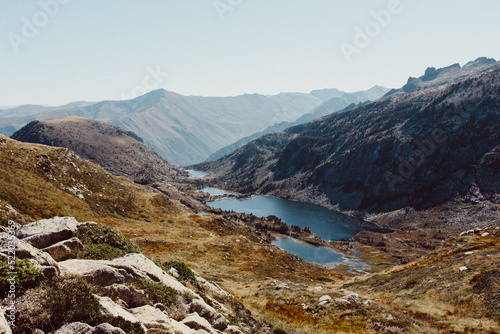view form the top of a mountain with a lake in the pyrenees in south france