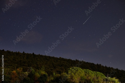 night landscape with shooting star