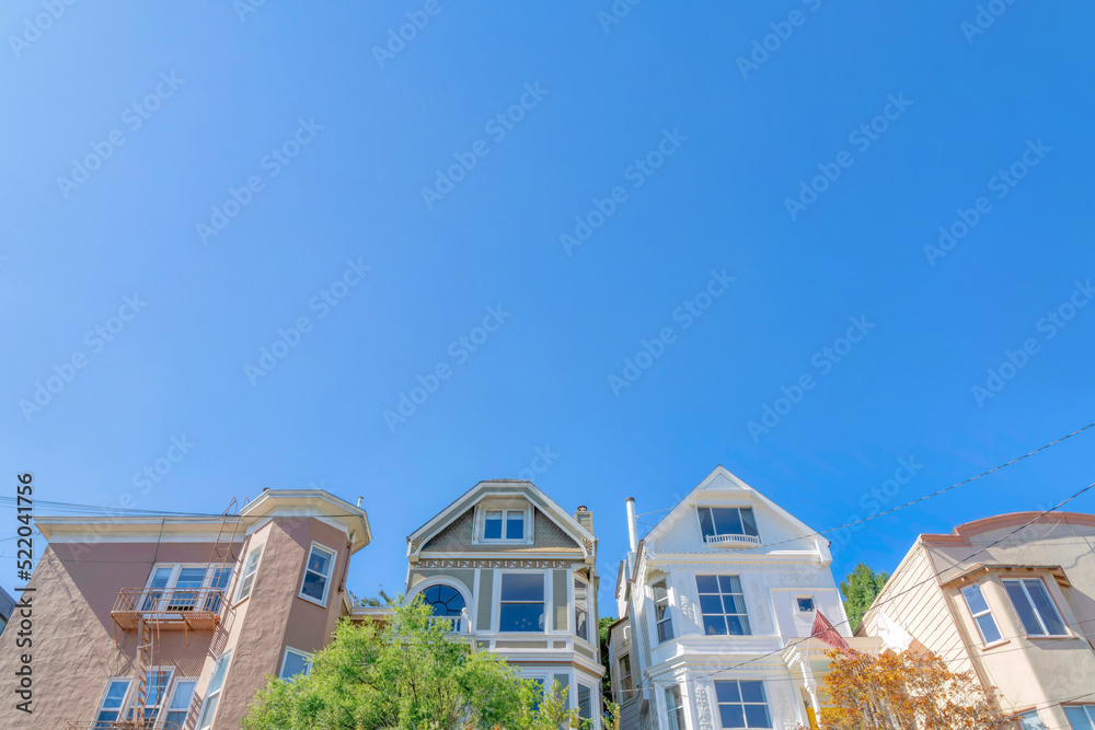Low angle view of middle class houses against the clear sky at San Francisco, California Low angle view of middle class houses against the clear sky at San Francisco, California