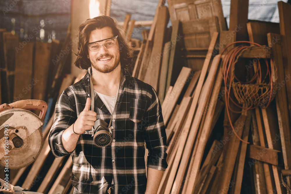 Portrait Carpenter man wood worker builder handsome smart thumbs up smiling for good job or done hand like work.