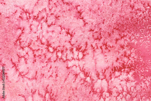 Watercolor texture made in salt technique. Pink abstract hand-drawn background.