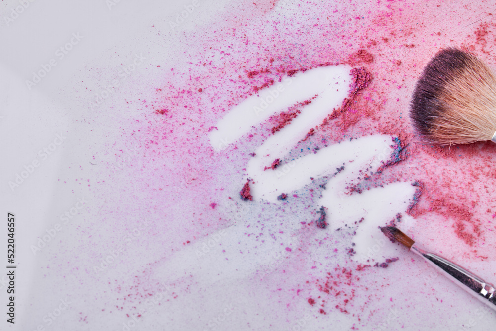 Fototapeta premium Pink face powder and makeup brush on white background. Close up make up brush.