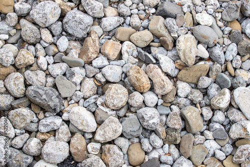 round sea pebbles, background, text.