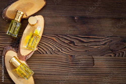 Arabian oud attar oil - perfume in glass bottles. Overhead view
