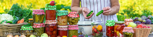 Принти на полотні Woman with jar preserved vegetables for winter. Selective focus.