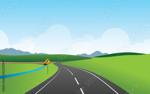 The road is marked with curved road signs, mountain and sky view vector