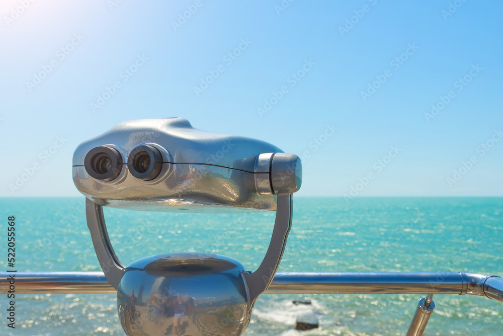 Observation deck with binocular to view the ocean sea.
