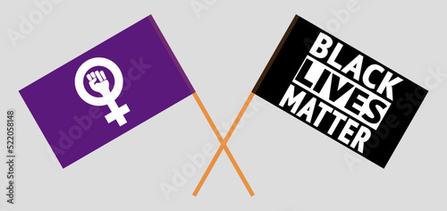 Crossed flags of Feminism and BLM