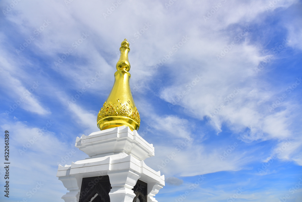 Naklejka premium Pagoda Wat Pa Ban Tat temple, Gold temple with beautiful cloudy in Udon Thani Thailand.