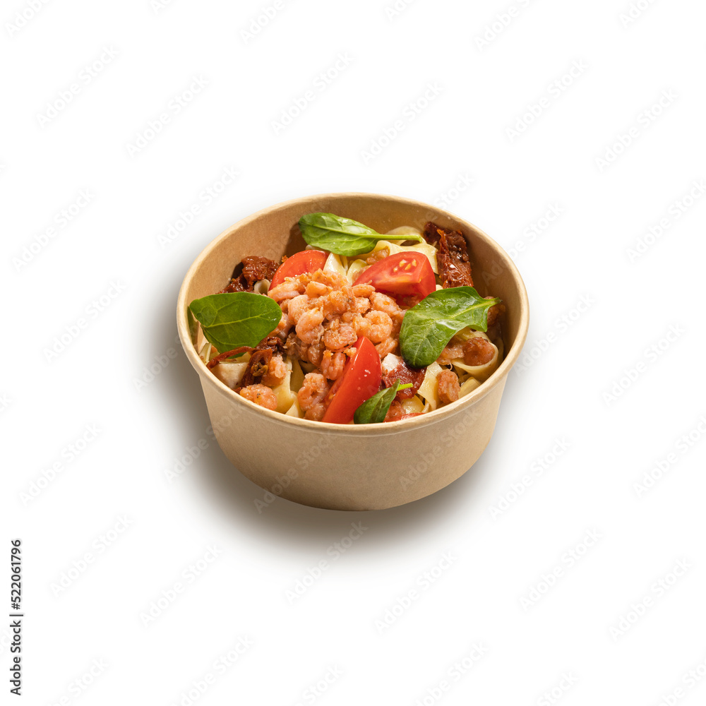 pasta with shrimp and tomato sauce on white pasta with shrimp and tomato sauce on white