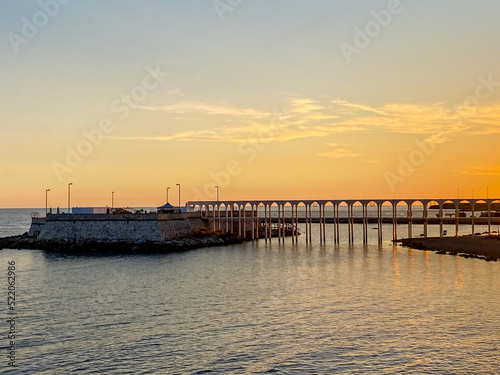 Views along the shore at sunset in Civitavecchia Italy