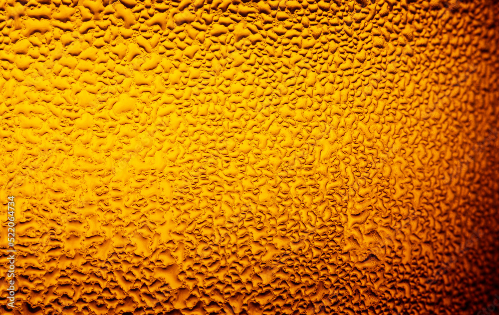 Macro beer bottle texture,Water drops texture on the bottle of beer. Abstract background,Water drops background Macro beer bottle texture,Water drops texture on the bottle of beer. Abstract background,Water drops background