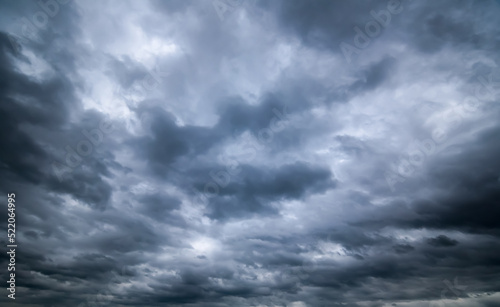 dark storm clouds with background,Dark clouds before a thunder-storm. © pinglabel