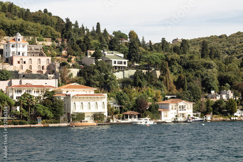 View of historical, traditional mansions by Bosphorus in Anadolu Hisari area of Asian side of Istanbul. It is a sunny summer day. Beautiful travel scene.