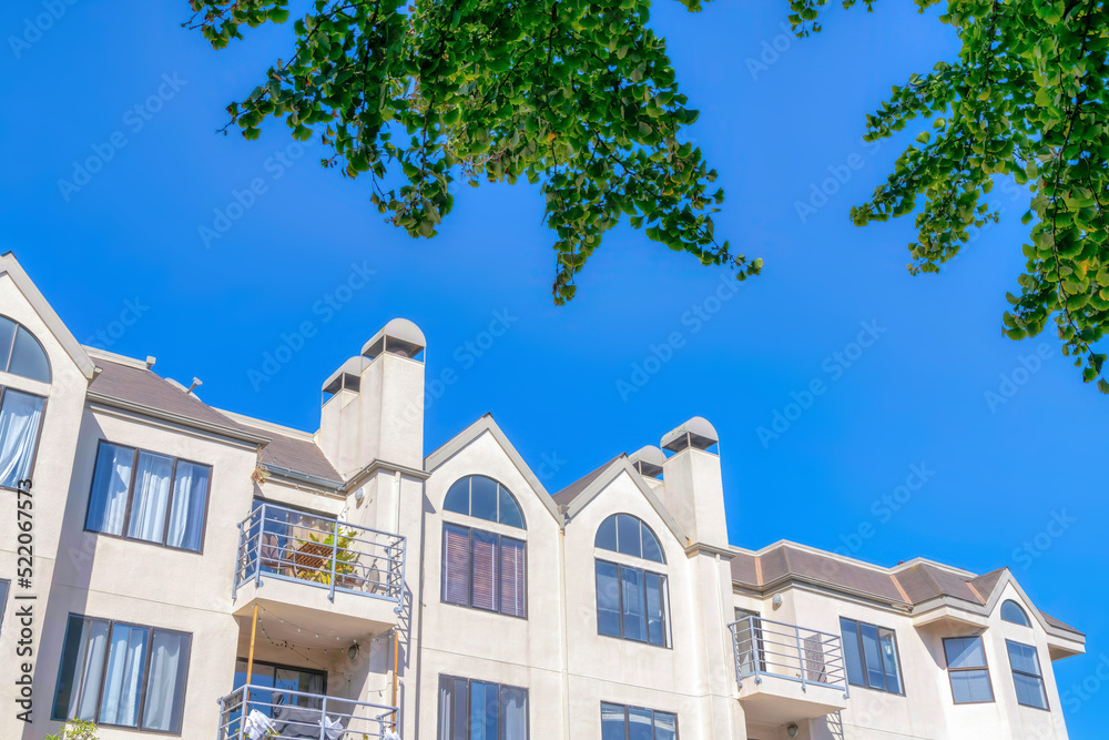 Fototapeta premium Apartment building with balconies in a low angle view at San Francisco, CA