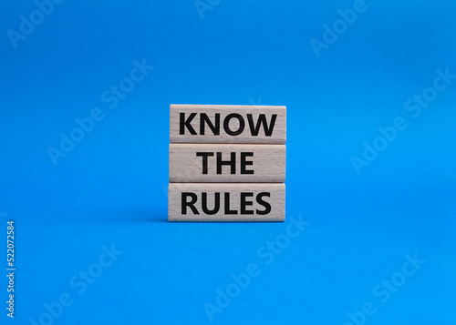 Know the rules symbol. Wooden blocks with words Know the rules. Beautiful blue background. Business and Know the rules concept. Copy space.