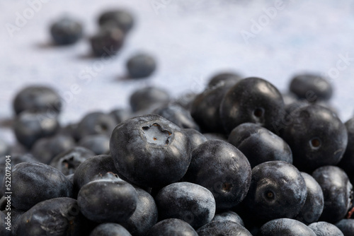 Macro close up of unwashed blueberries.