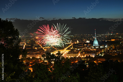 Fireworks show on panoramic scenic view of city downtown from the hill Turin Italy.