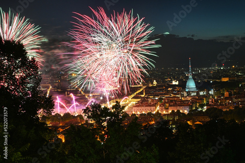 Fireworks show on panoramic scenic view of city downtown from the hill Turin Italy.