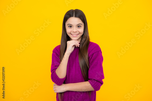 Children studio portrait on yellow background. Childhood lifestyle concept. Cute teenage girl face close up. © Olena