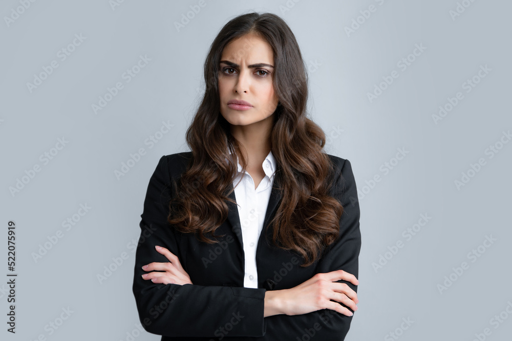 Negative business woman isolated over gray background. Displeased angry businesswoman blocking offer, showing cross stop gesture, negative reply. Negative business woman isolated over gray background. Displeased angry businesswoman blocking offer, showing cross stop gesture, negative reply.