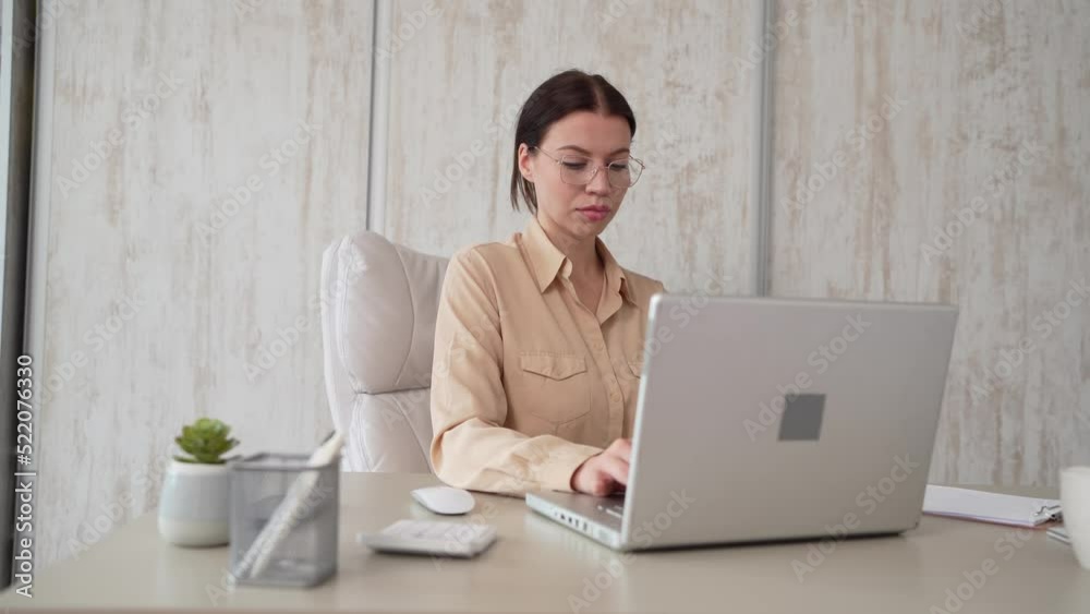 Caucasian woman businesswoman work in the office on laptop computer Caucasian woman businesswoman work in the office on laptop computer