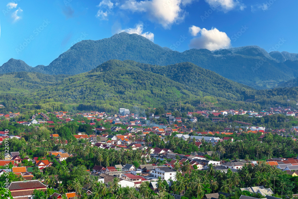 Luang Prabang Laos surrounded by the high mountains and the Mekong River. This lovely city is nestled in the high mountains and tropical rainforest