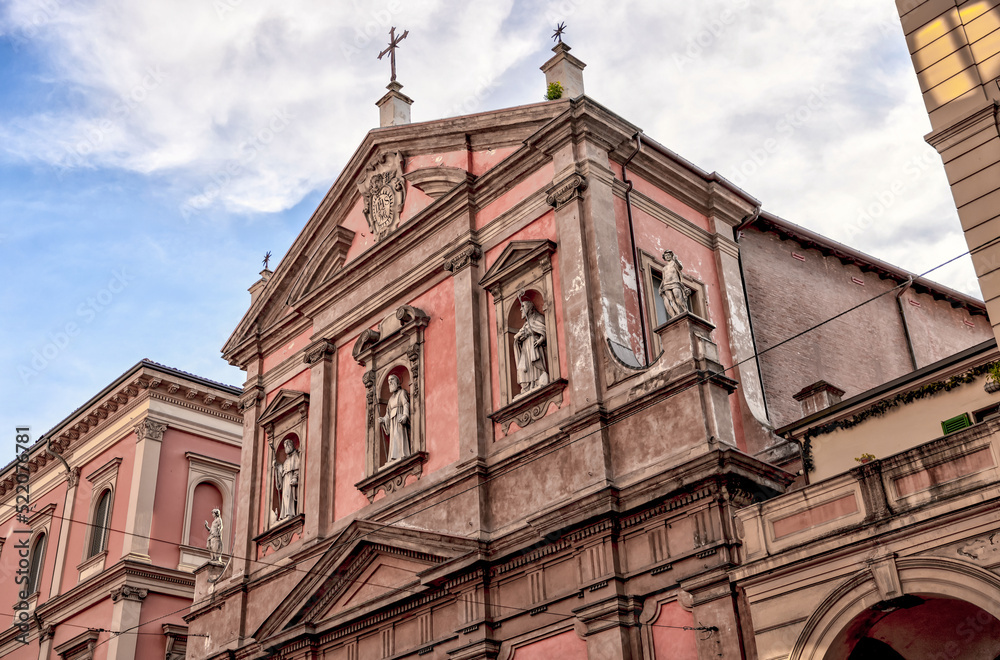 Building facades and medieval architecture along the streets in Bologna