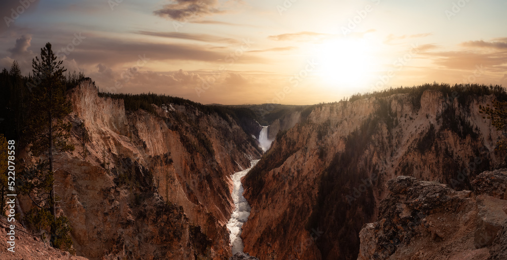 Rocky Canyon, River and Waterfall in American Landscape. Grand Canyon of The Yellowstone. Dramatic Sunset Sky Art Render. Yellowstone National Park. United States. Nature Background.