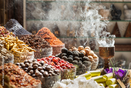 Fototapeta Naklejka Na Ścianę i Meble -  Various spices and bukhoor agar wood burner at Dubai spice market, United Arab Emirates
