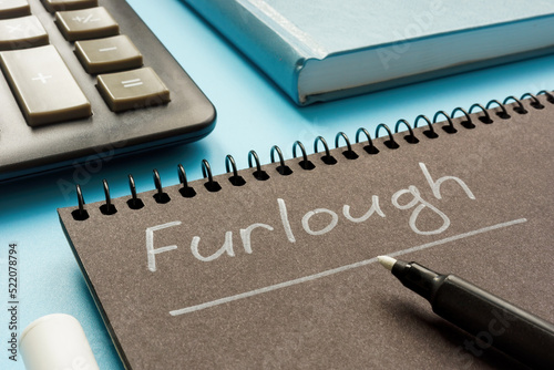 Written word Furlough on the notepad by marker.