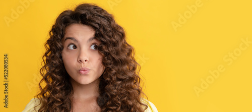 girl has wavy hairdo. portrait of frizz child. express positive emotion. Child face, horizontal poster, teenager girl isolated portrait, banner with copy space.