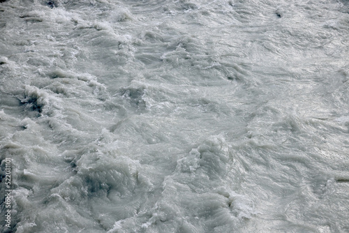 Photography Raging muddy water of a mountain river